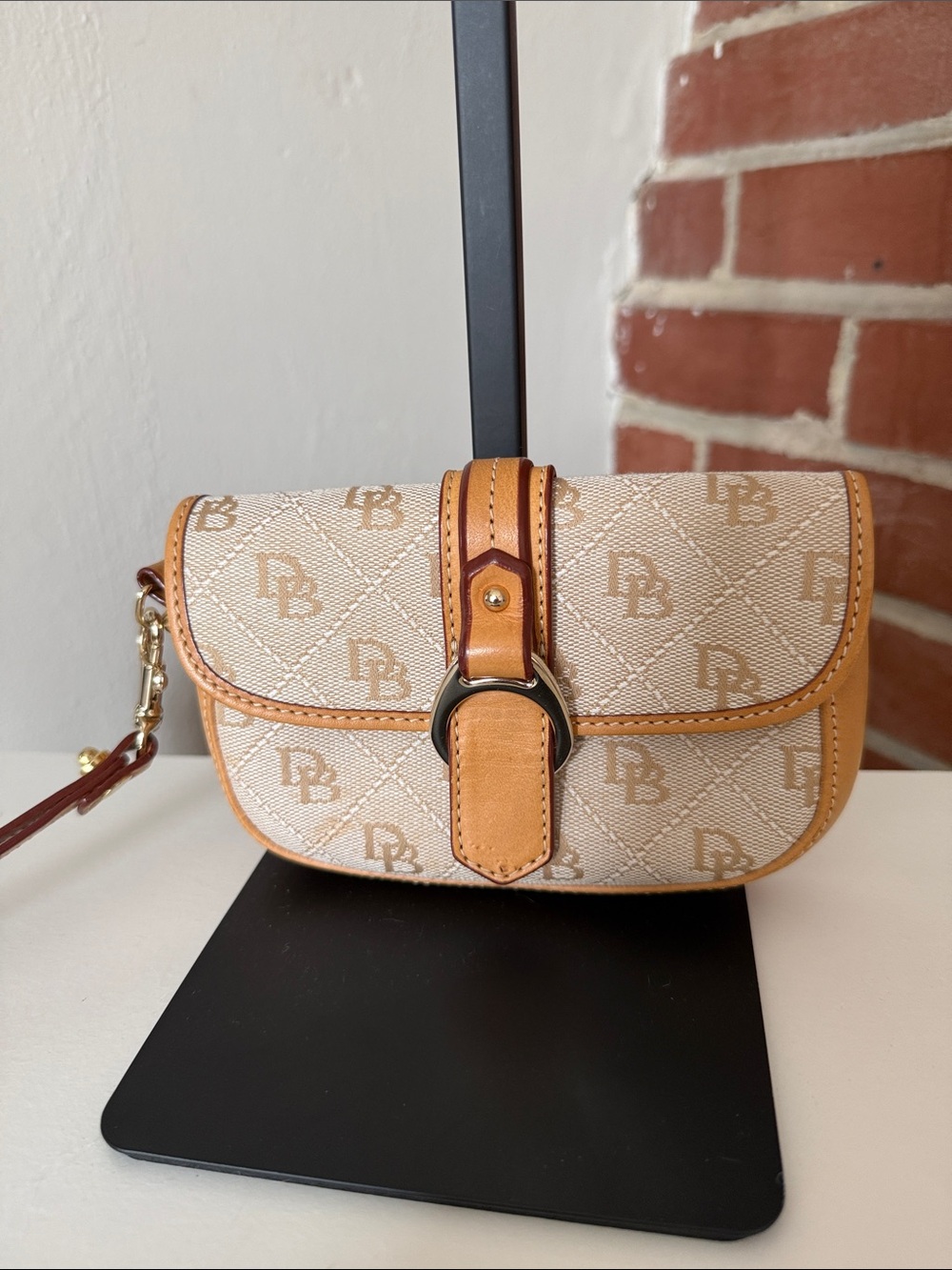 Dooney & Bourke Beige & Tan Monogram Wristlet with Buckle Detail